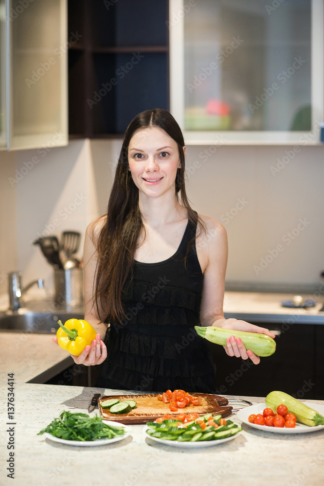 Young Woman Cooking in the kitchen.