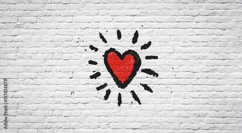 Coeur sur mur de briques