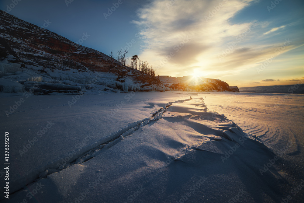 Baikal winter sunset near the island Ogoy