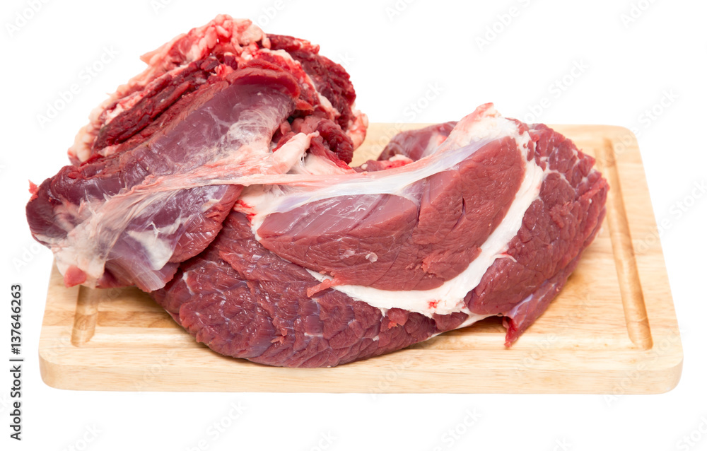 meat on a board on a white background
