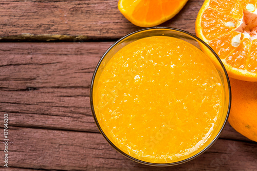 Orange juice on a wooden table