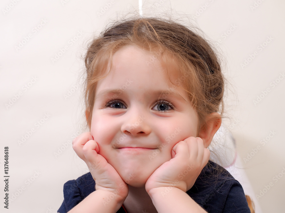 Portrait of a happy little girl. Beautiful eyes with long fluffy eyelashes Portrait of a happy little girl. Beautiful eyes with long fluffy eyelashes
