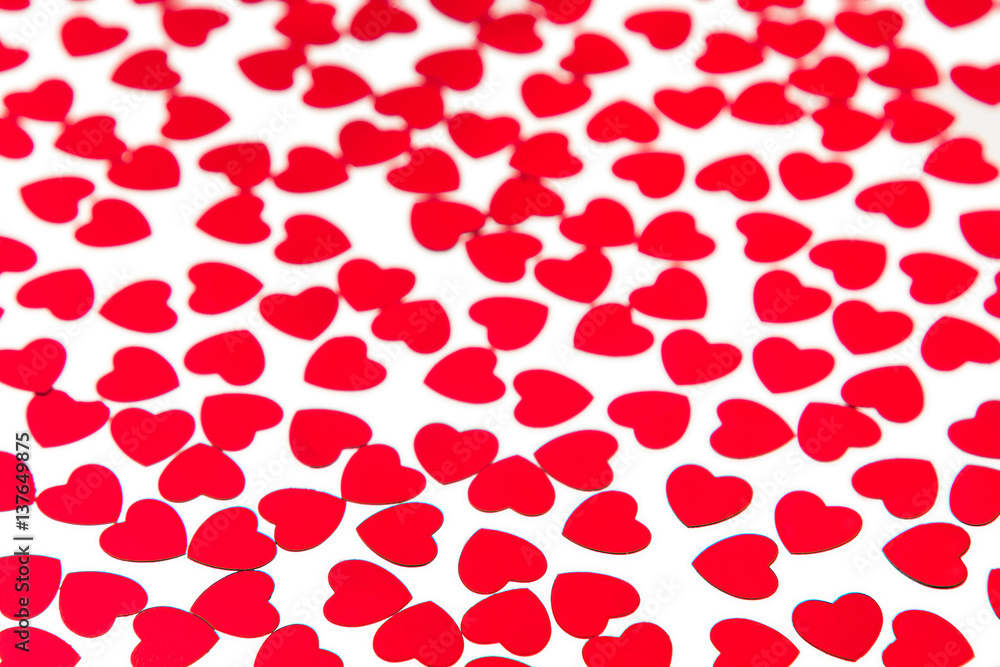 Valentines day pattern of red hearts confetti on white background. Festive Valentine. Valentines day pattern of red hearts confetti on white background. Festive Valentine.