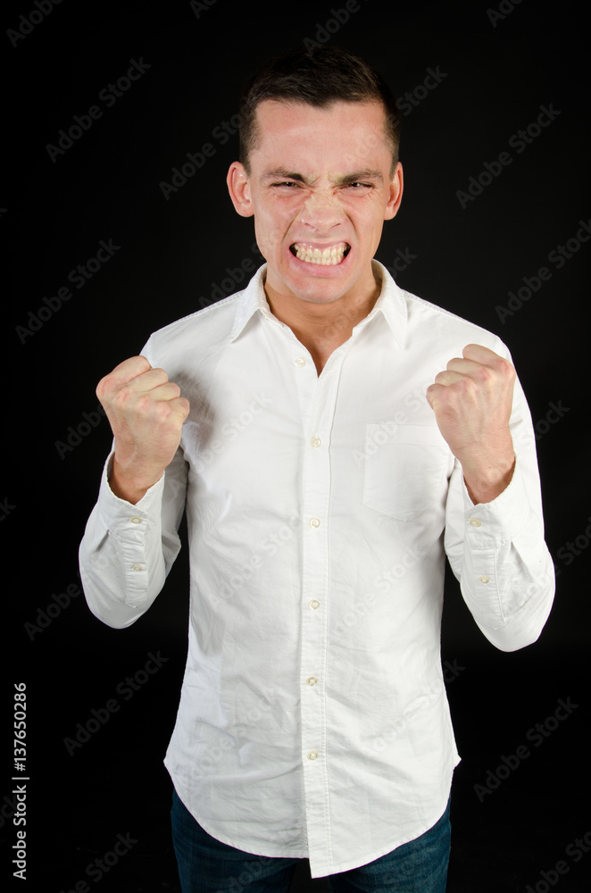 Anger and aggression. Young man screaming. Anger and aggression. Young man screaming.