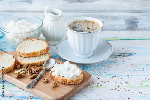 Serving breakfast sandwiches with ricotta, walnuts and honey photo