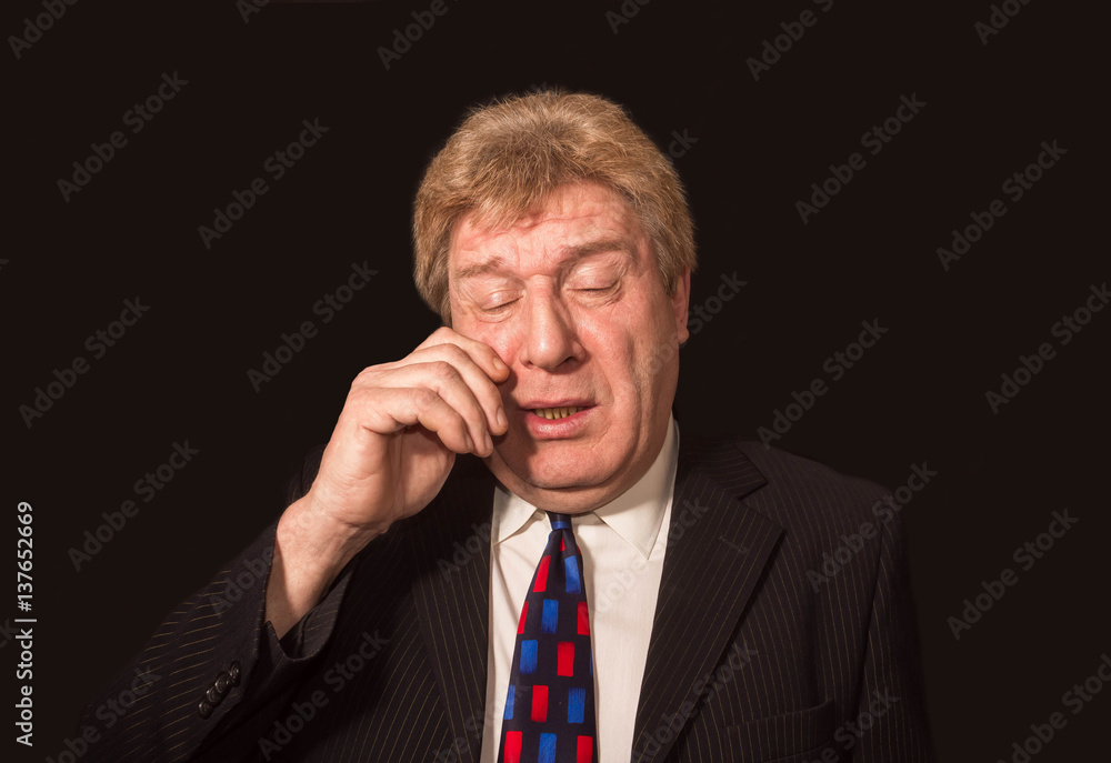 Stressed senior caucasian businessman rubbing eyes Stressed senior caucasian businessman rubbing eyes