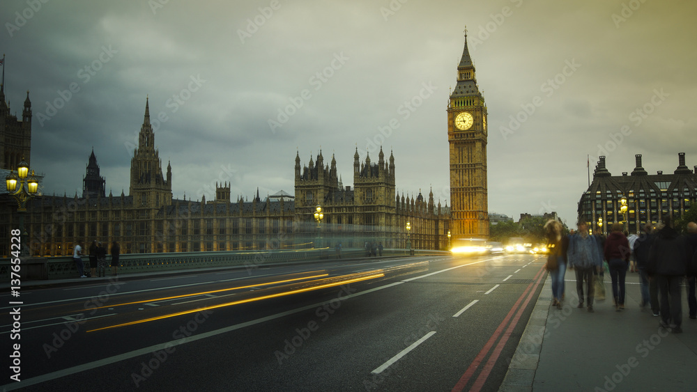 LONDON, UK - APRIL: Traffic and pedestrians on Westminster Bridge near Big Ben and Parliament