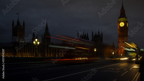 LONDON  UK - APRIL  Traffic and pedestrians on Westminster Bridge near Big Ben and Parliament