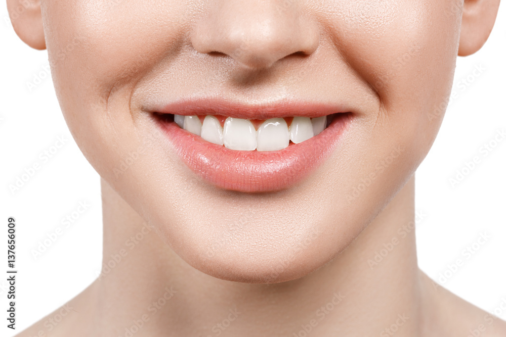 Obraz premium Close up of beautiful wide smile of young fresh woman with great healthy white teeth. Isolated over white background