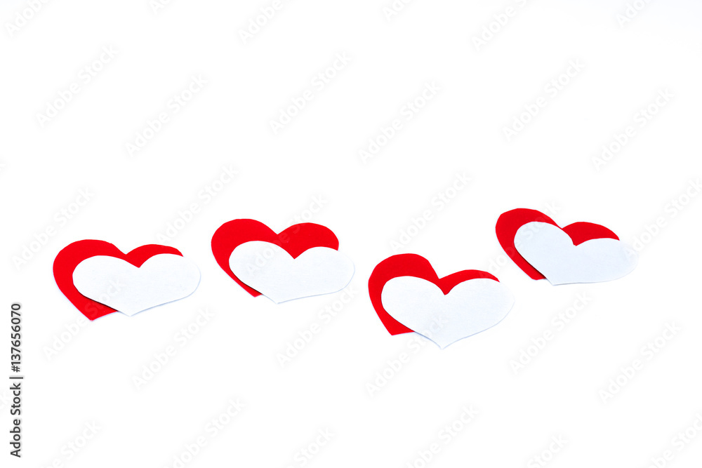 Red and white hearts on a white background