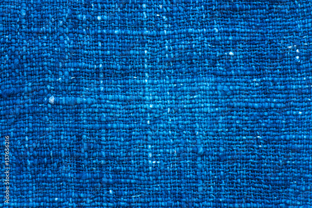 Closeup dark blue yarn textile background and textured,  Detail of blue canvas textured or blue fabric background