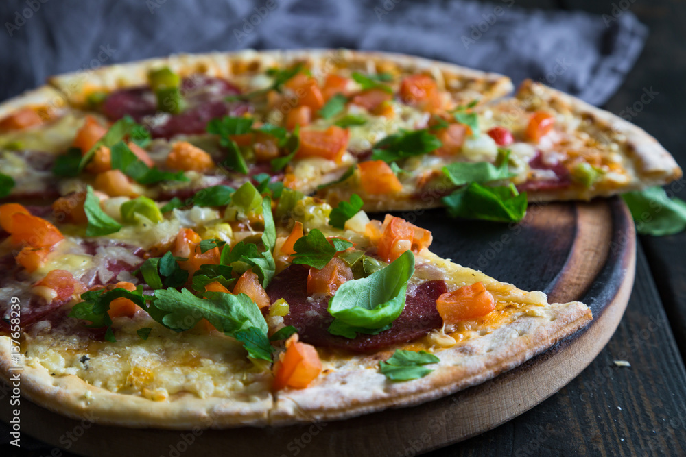 Pizza with salami and vegetables Pizza with salami and vegetables