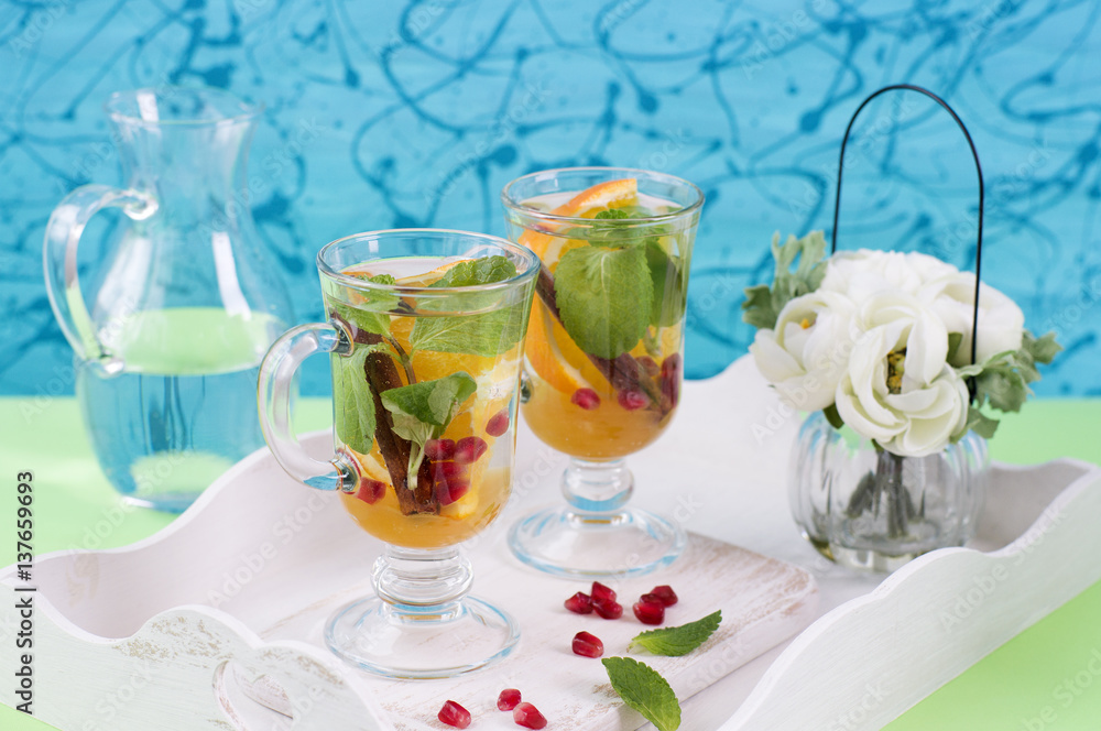 Herbal tea with sliced orange, mint and cinnamon Herbal tea with sliced orange, mint and cinnamon