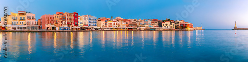 Picturesque panoramic view of old harbour with Lighthouse of Chania at sunrise, Crete, Greece photo