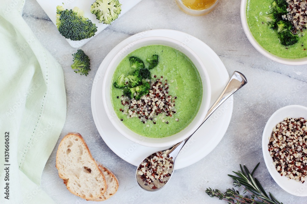 Broccoli soup with quinoa topping. Super foods and clean eating concept.Selective focus Broccoli soup with quinoa topping. Super foods and clean eating concept.Selective focus