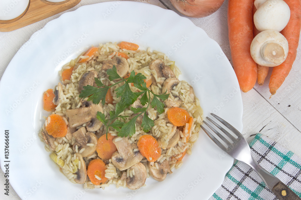 Εκτύπωση καμβά Risotto with mushrooms and vegetables in plate on table