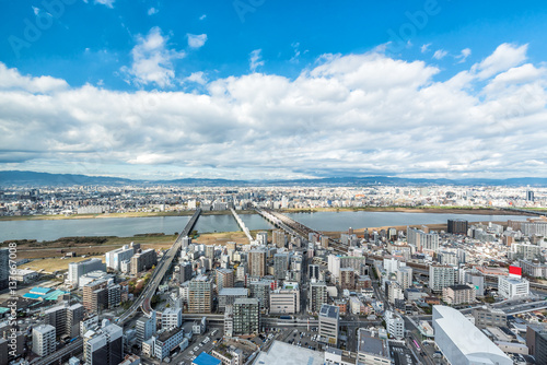 Fototapeta Naklejka Na Ścianę i Meble -  Osaka urban city and Yodo river from rooftop view. Japan.