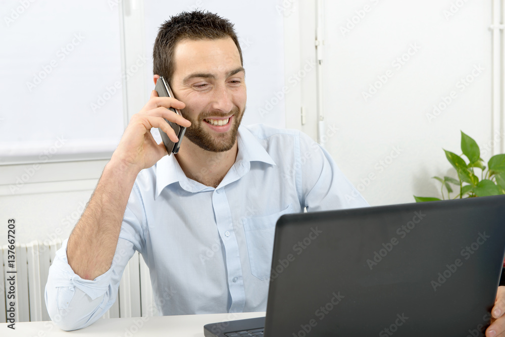 Portrait of a young businessman in his office Portrait of a young businessman in his office