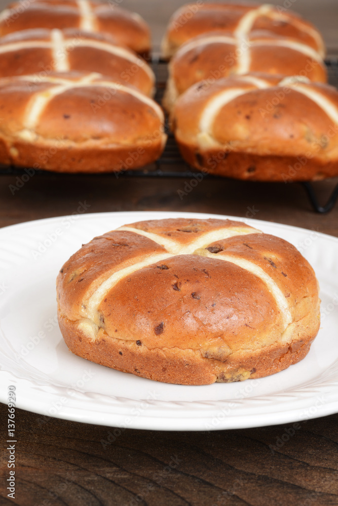 closeup hot cross bun on plate