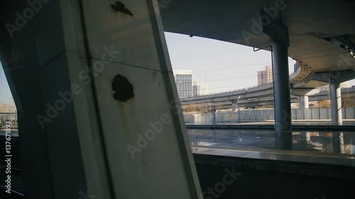 Chinese high speed train leaves station. View from the inside
