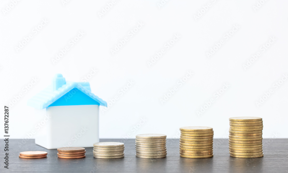 Saving to buy a house that stack coin growing ,saving money or money growth concept Saving to buy a house that stack coin growing ,saving money or money growth concept
