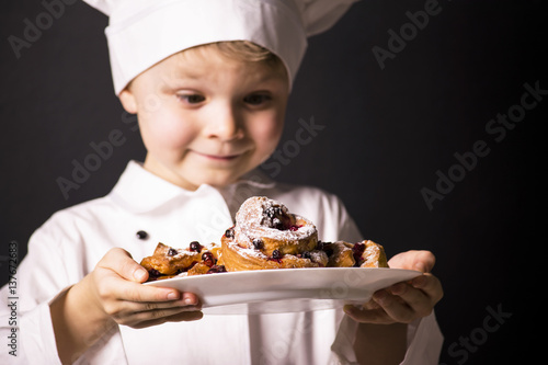Chef holding croissants with cranberry