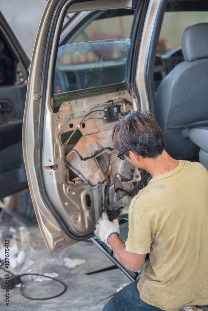 Auto mechanic repairing car. Auto mechanic repairing car.