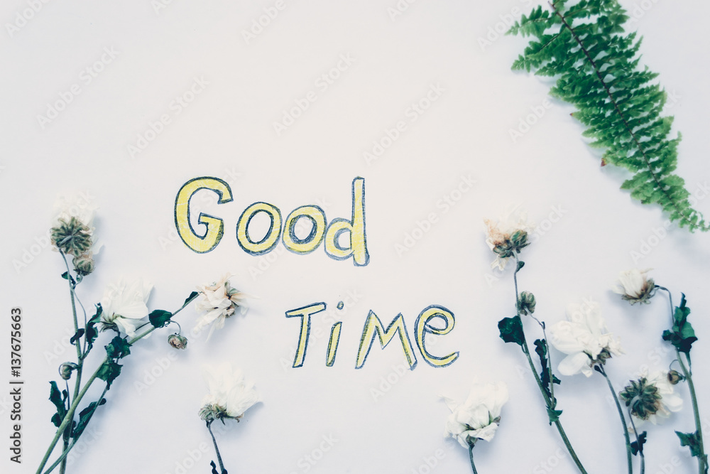 Fototapeta premium The inscription on a white background with the leaves of plants