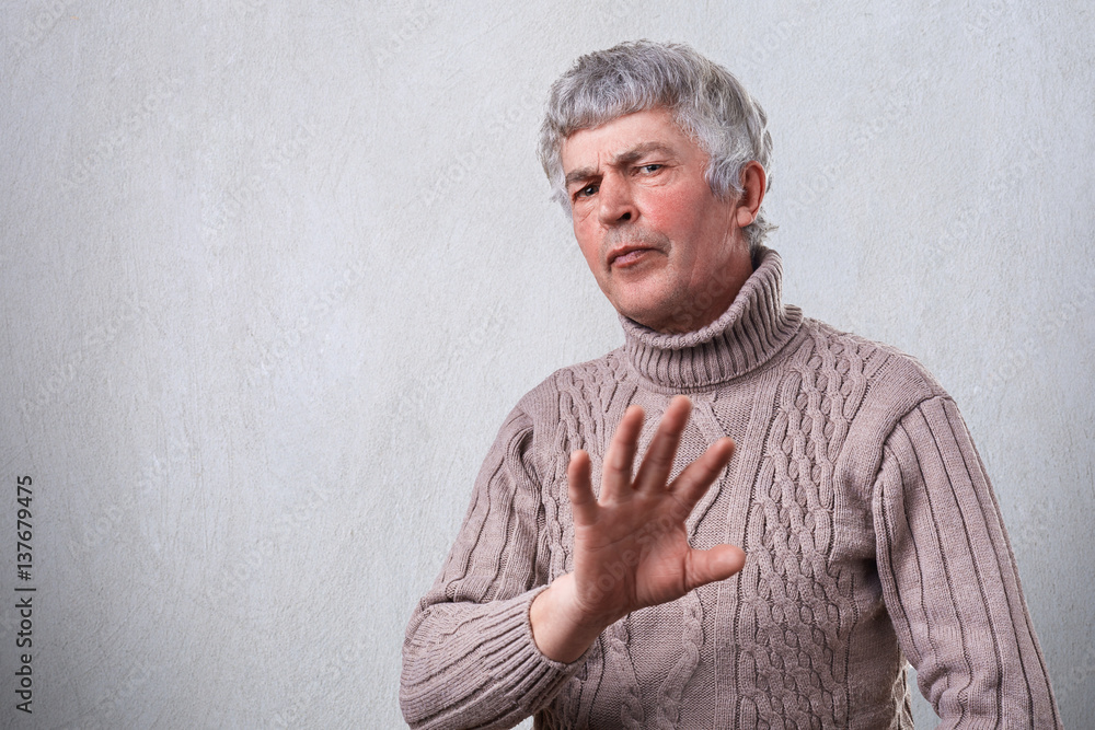 Refusing Body An angry frowning mature man having negative expression showing ...