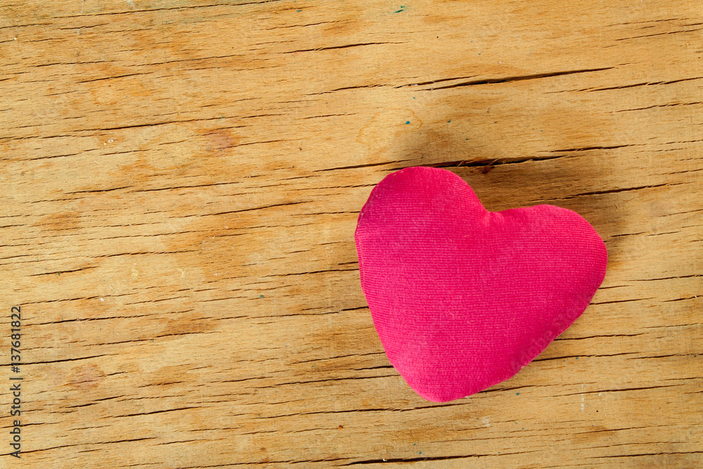 Heart from cloth on wood desk Heart from cloth on wood desk