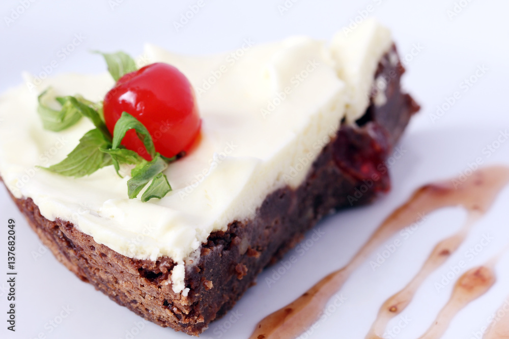 isolated served slice of delicious chocolate brownie cake with cherry
isolated served slice of delicious chocolate brownie cake with cherry