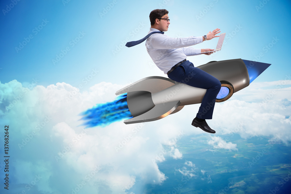 Businessman flying on rocket in business concept Businessman flying on rocket in business concept