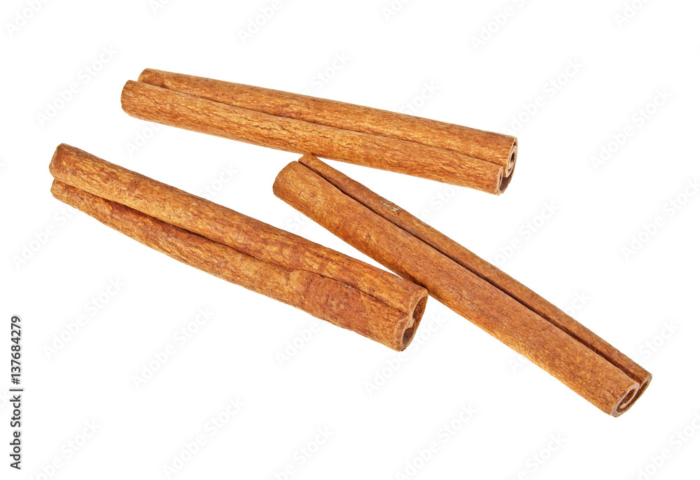 Cinnamon sticks on white background, top view Cinnamon sticks on white background, top view
