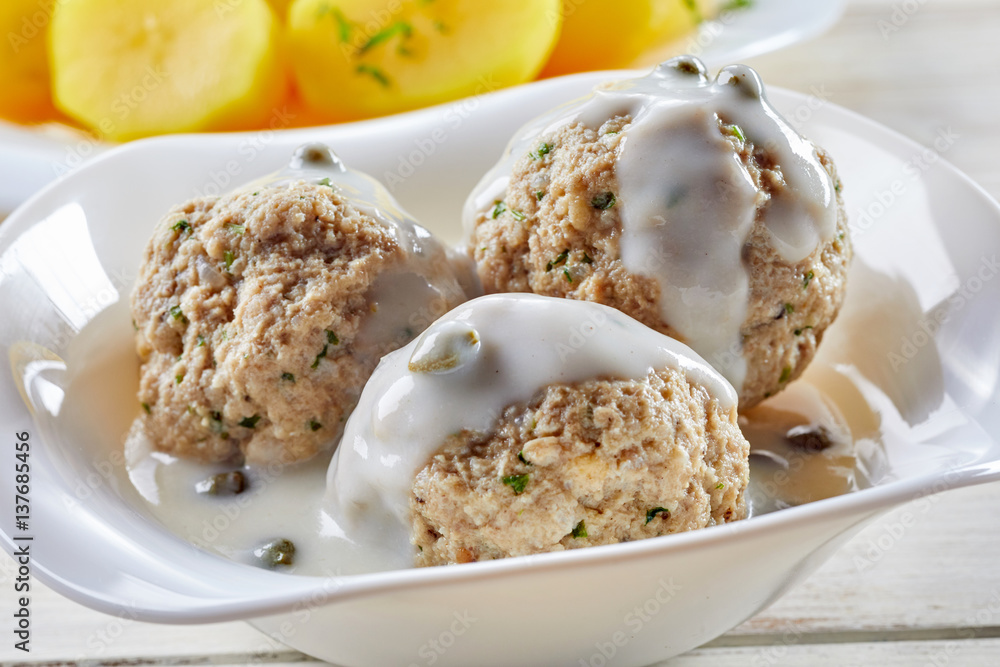 Close up view of German meatball dish in sauce Close up view of German meatball dish in sauce