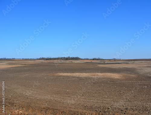 beautiful spring landscape  vsphannoe field on a background of blue sky  agriculture  earth  nature  countryside 