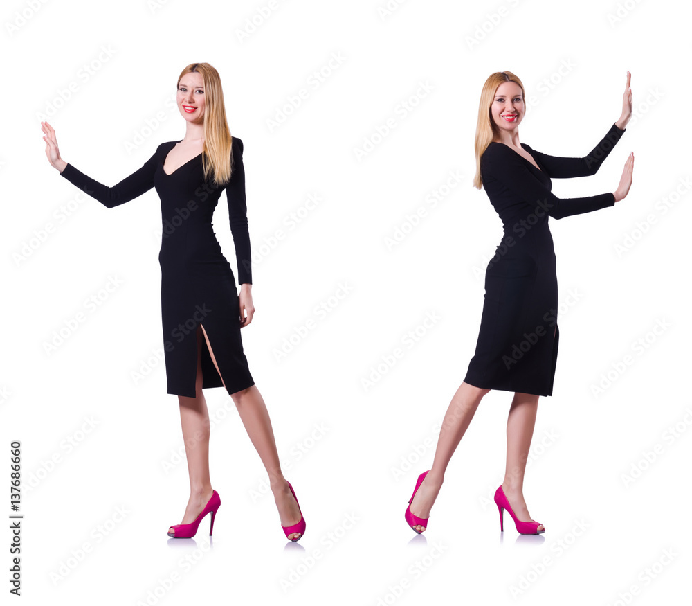Young girl in black dress pushing isolated on white Young girl in black dress pushing isolated on white