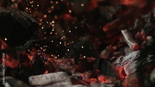 MACRO COALS: iron stick mixes burning coal