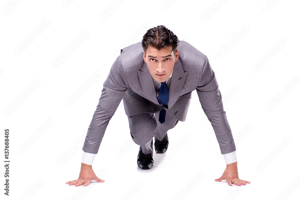Businessman on start ready for running isolated on white Businessman on start ready for running isolated on white