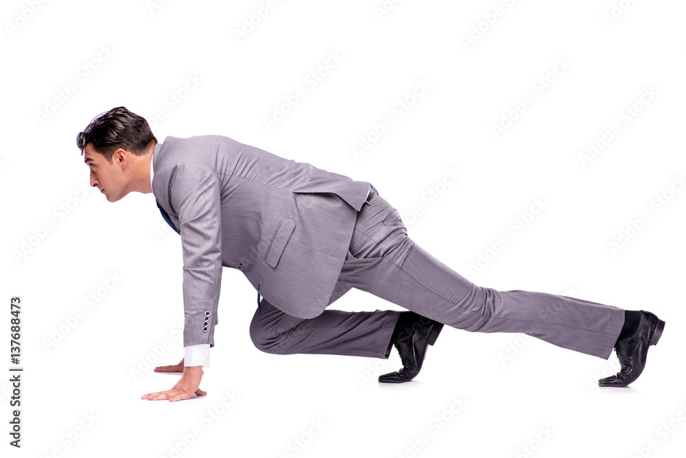 Businessman on start ready for running isolated on white Businessman on start ready for running isolated on white