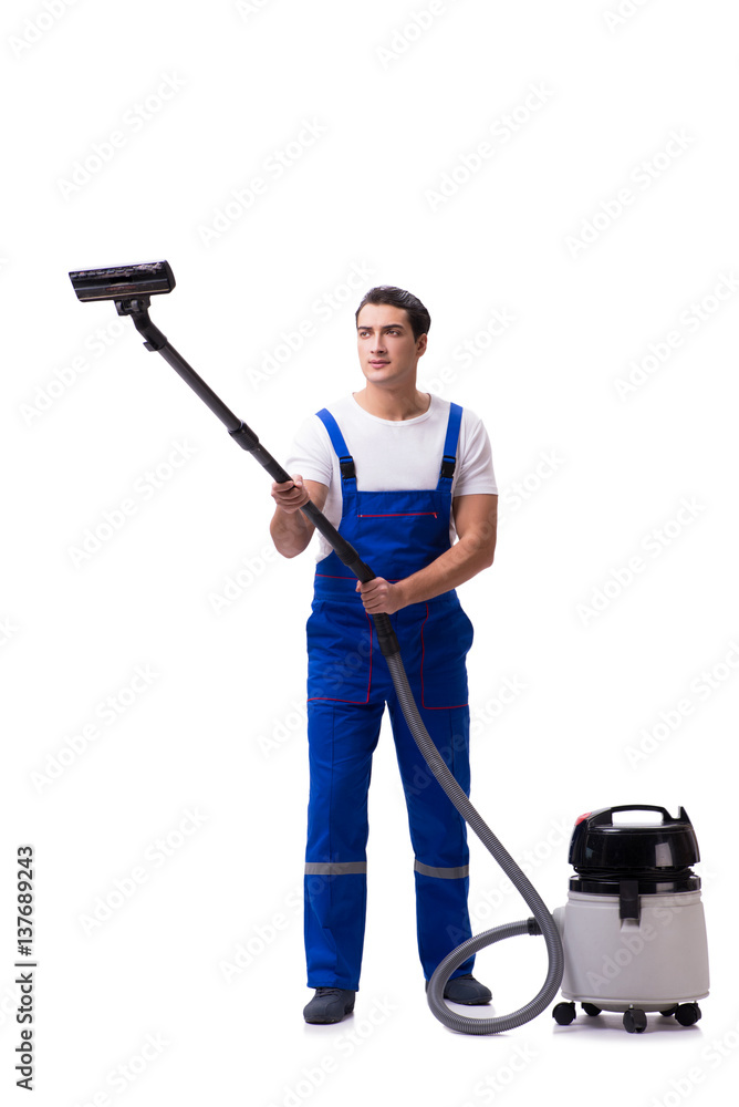 Man in coveralls doing vacuum cleaning on white Man in coveralls doing vacuum cleaning on white