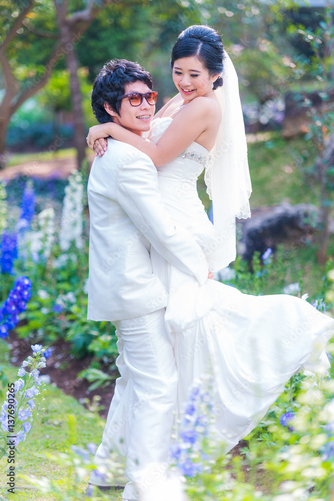 Asian Bride and Groom on Natural Background Asian Bride and Groom on Natural Background