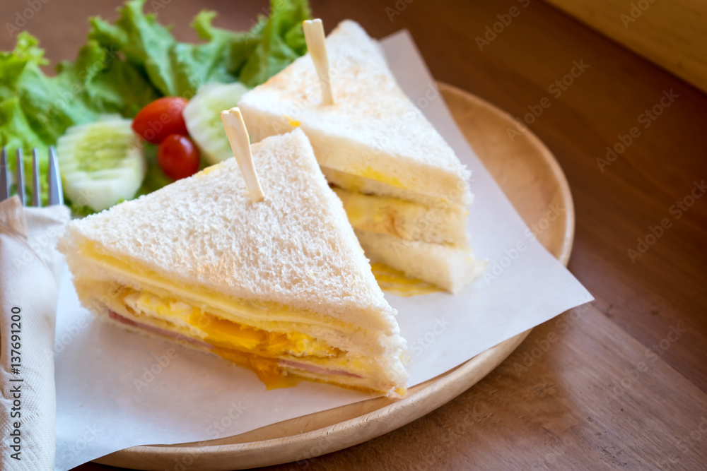 slice ham cheese egg sandwich breakfast with fresh vegetable slice ham cheese egg sandwich breakfast with fresh vegetable