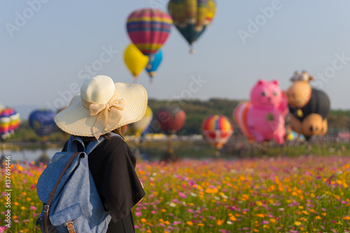 Woman tourist is traveling into Balloon festival