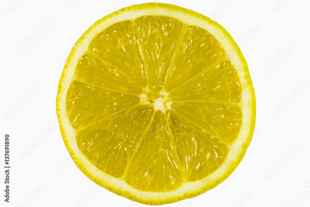 a cross-section of a half of a ripe yellow lemon exposed inside the fruit enlarged into the entire frame on a white background zoom on full frame - obrazy, fototapety, plakaty 