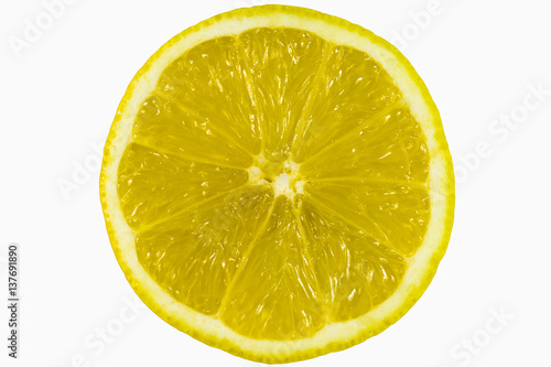 a cross-section of a half of a ripe yellow lemon exposed inside the fruit enlarged into the entire frame on a white background zoom on full frame