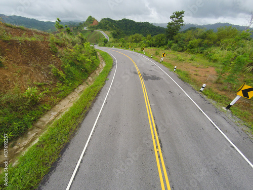 Aerial view of crooked path of road on the mountain, Shot from drone.