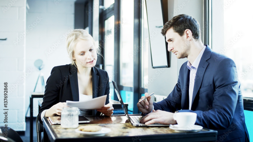 Businesswoman Explains Something to Her Partner Businesswoman Explains Something to Her Partner