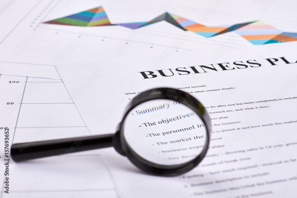 Loupe and documents. Successful business strategy. Business plan. Loupe and documents. Successful business strategy. Business plan.
