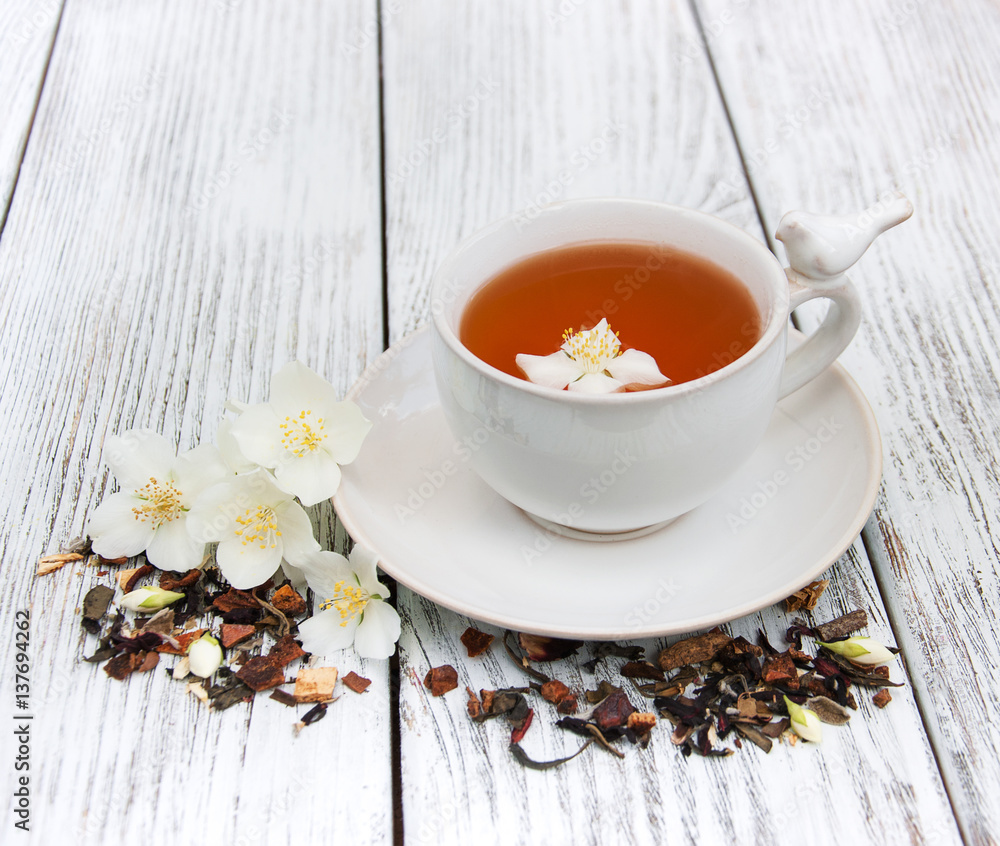 Cup of tea with jasmine flowers Cup of tea with jasmine flowers