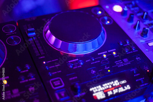 DJ Mixes and Play at Disco Party